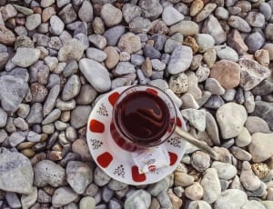 white and red ceramic saucer thumbnail