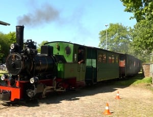 green and black steam train thumbnail