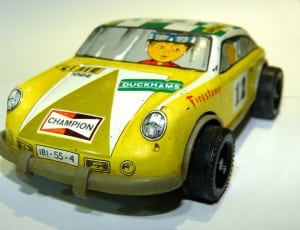 yellow and green plastic toy car thumbnail