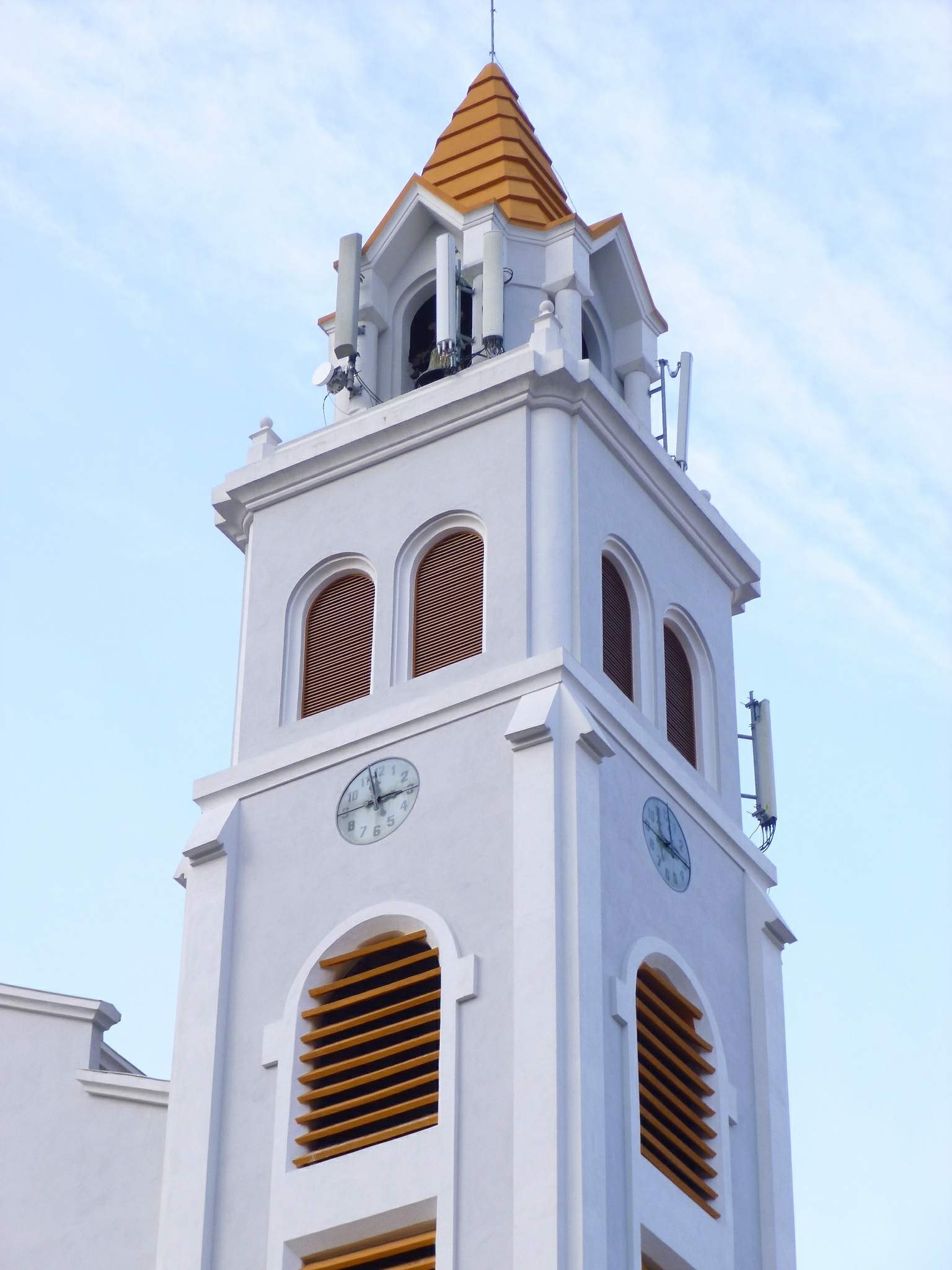 white painted tower with clock