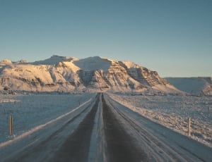 road near mountain range during daytime thumbnail