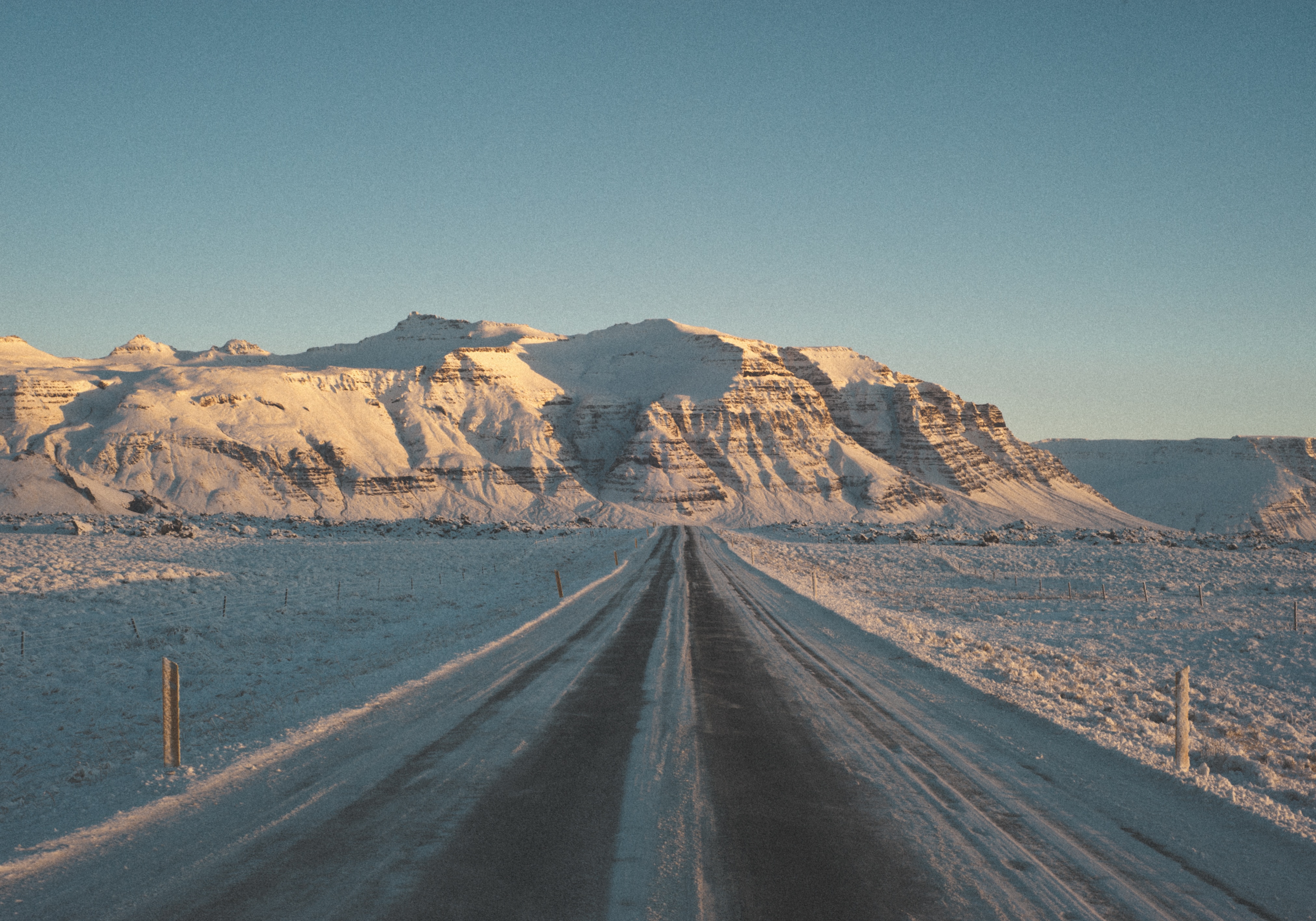 road near mountain range during daytime
