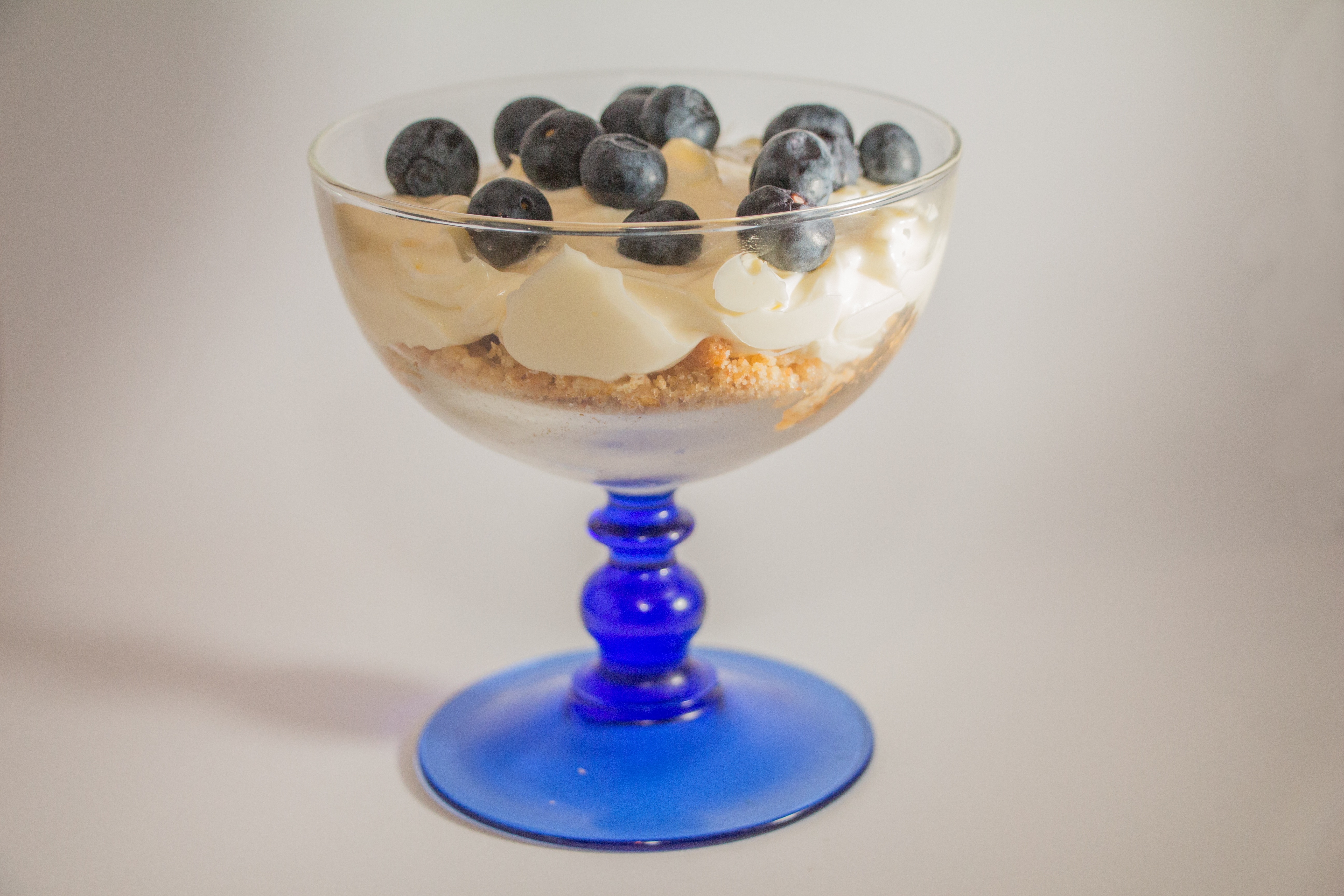 blueberries icing dessert on parfait glass