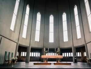 brown wooden altar inside gray dome church thumbnail
