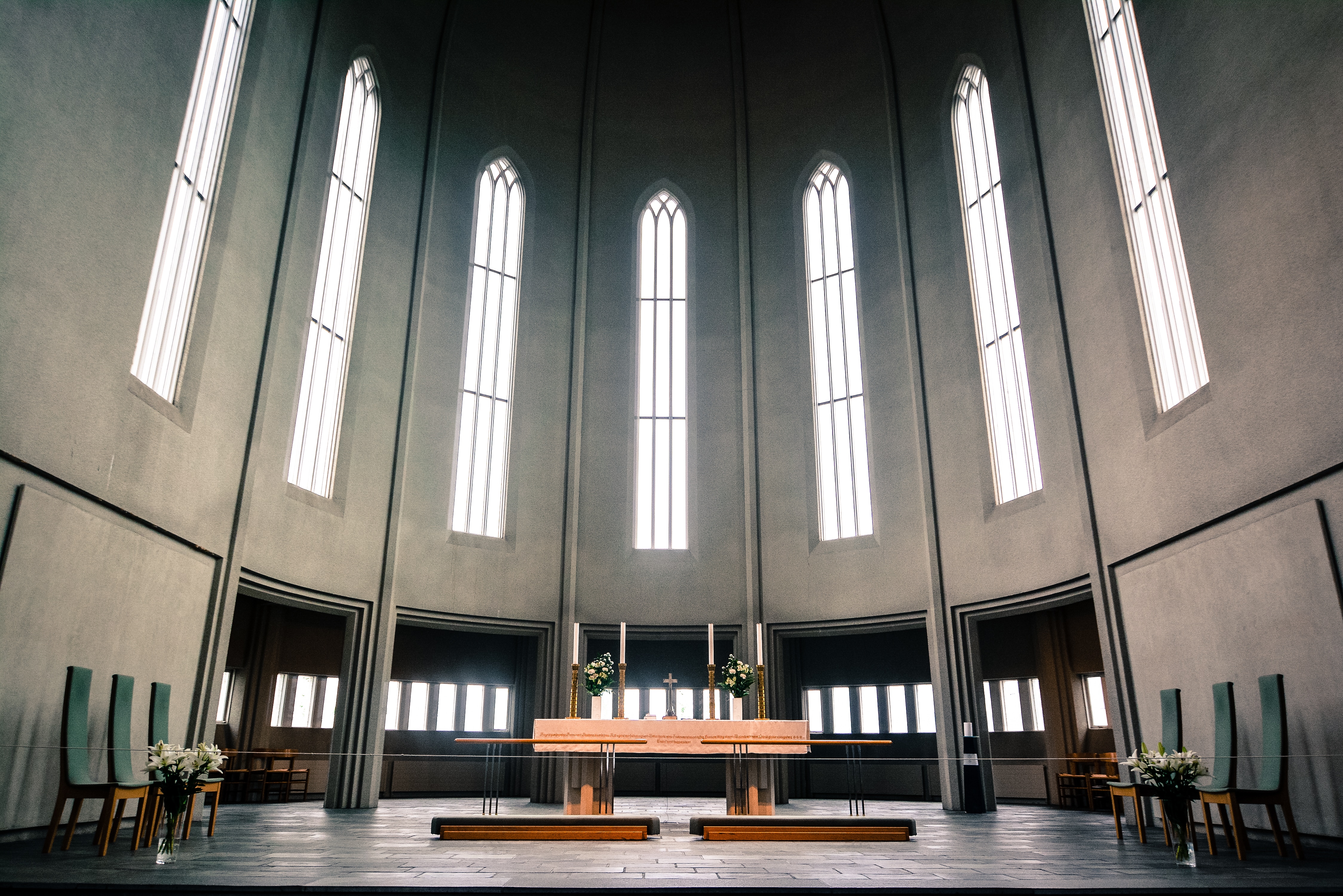 brown wooden altar inside gray dome church