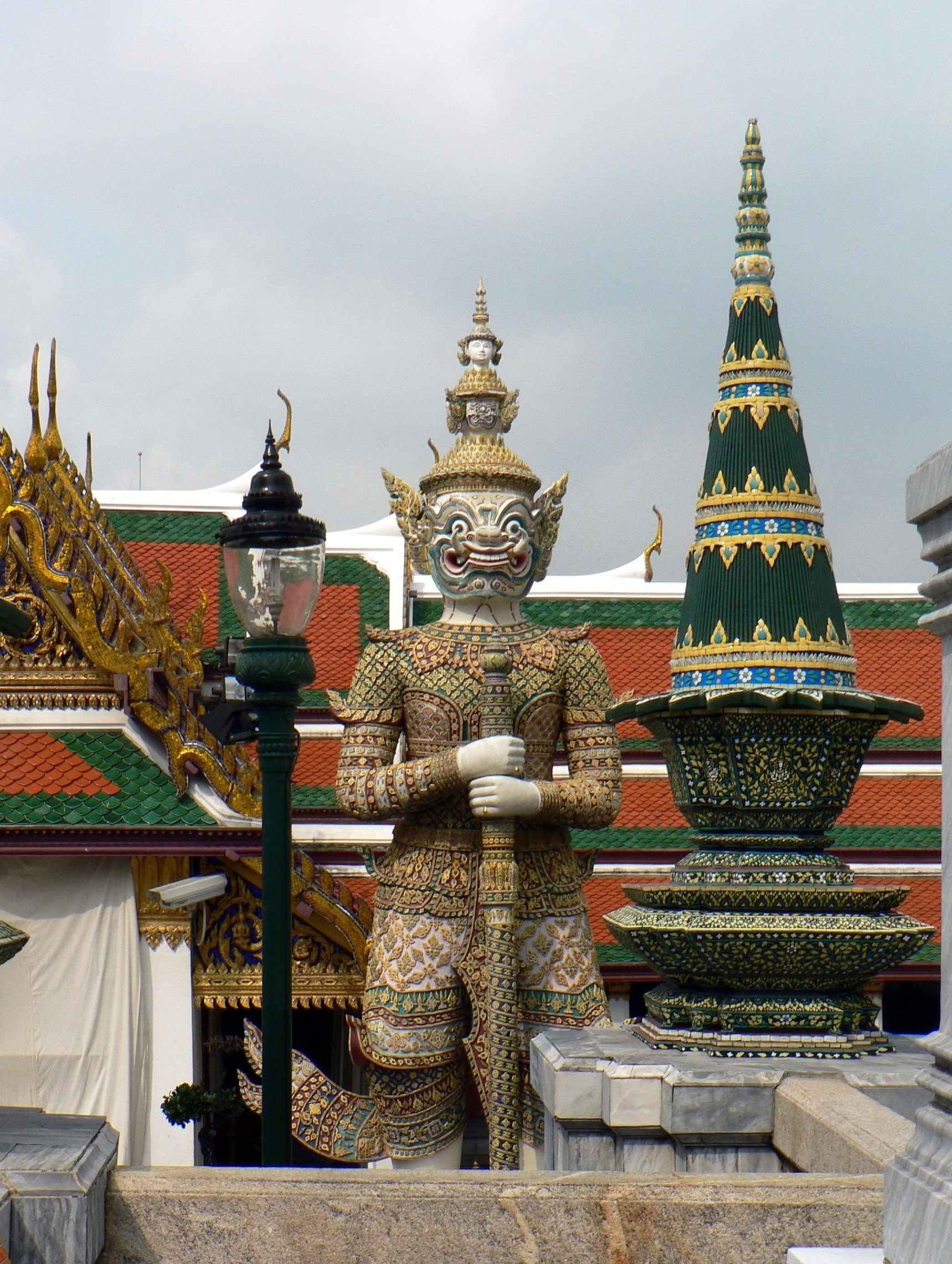 yellow white and green god statue