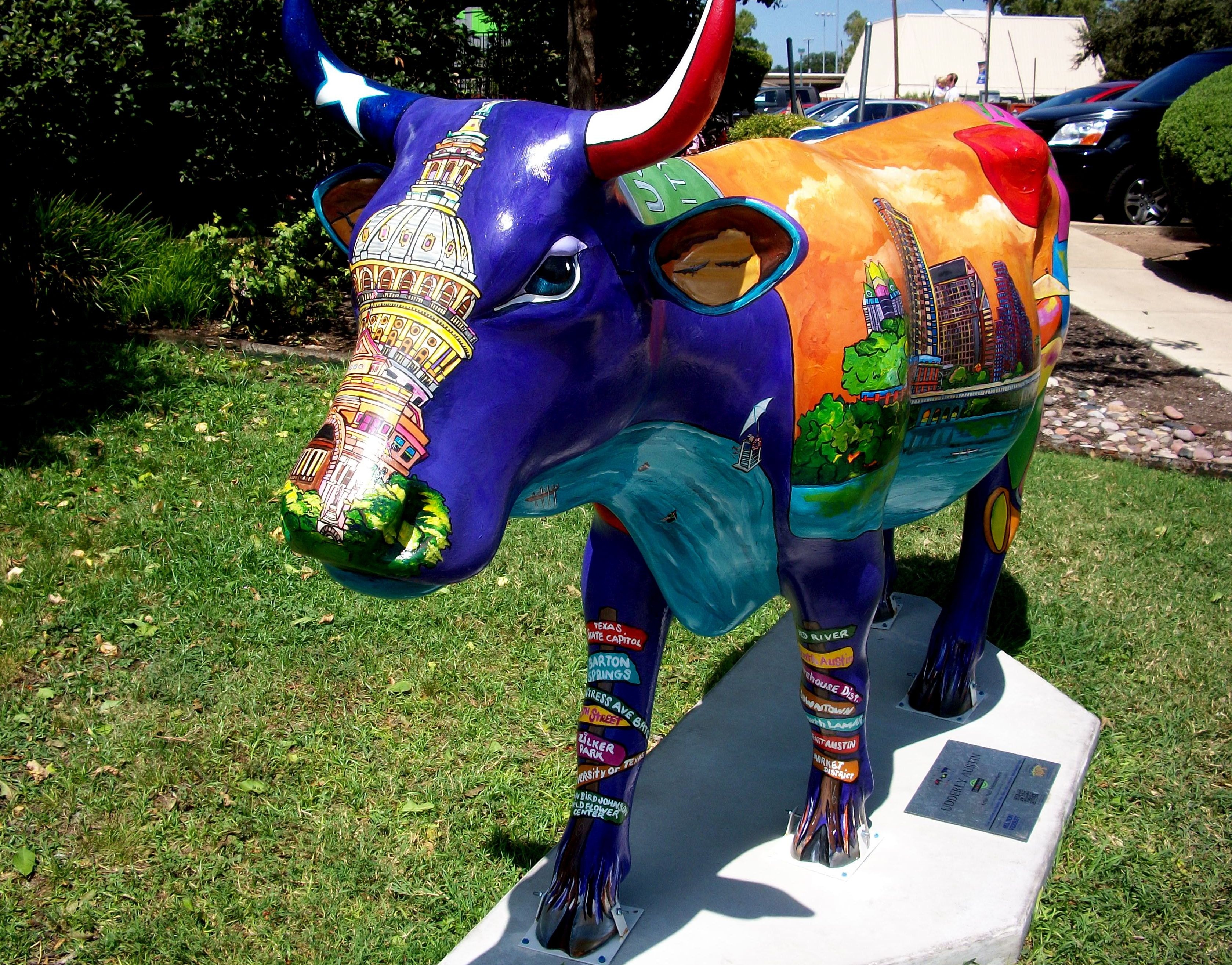 blue and green multi colored bull standee