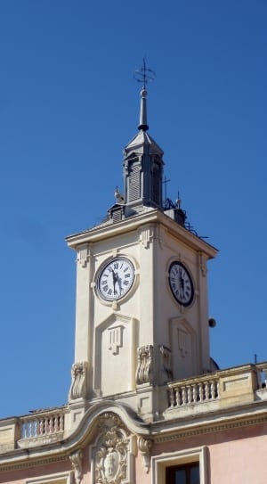 white and gray concrete tower with clock thumbnail