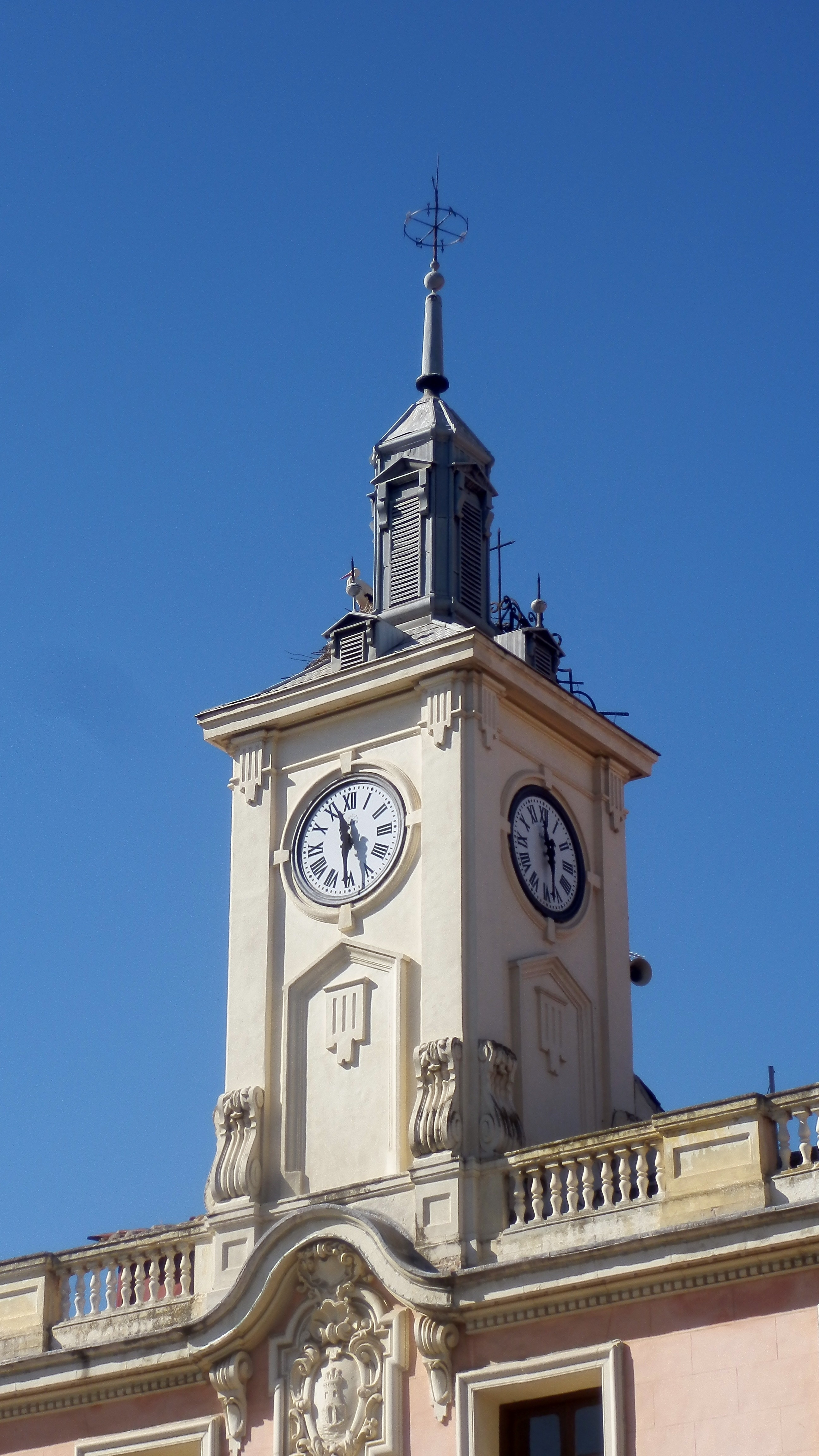 white and gray concrete tower with clock