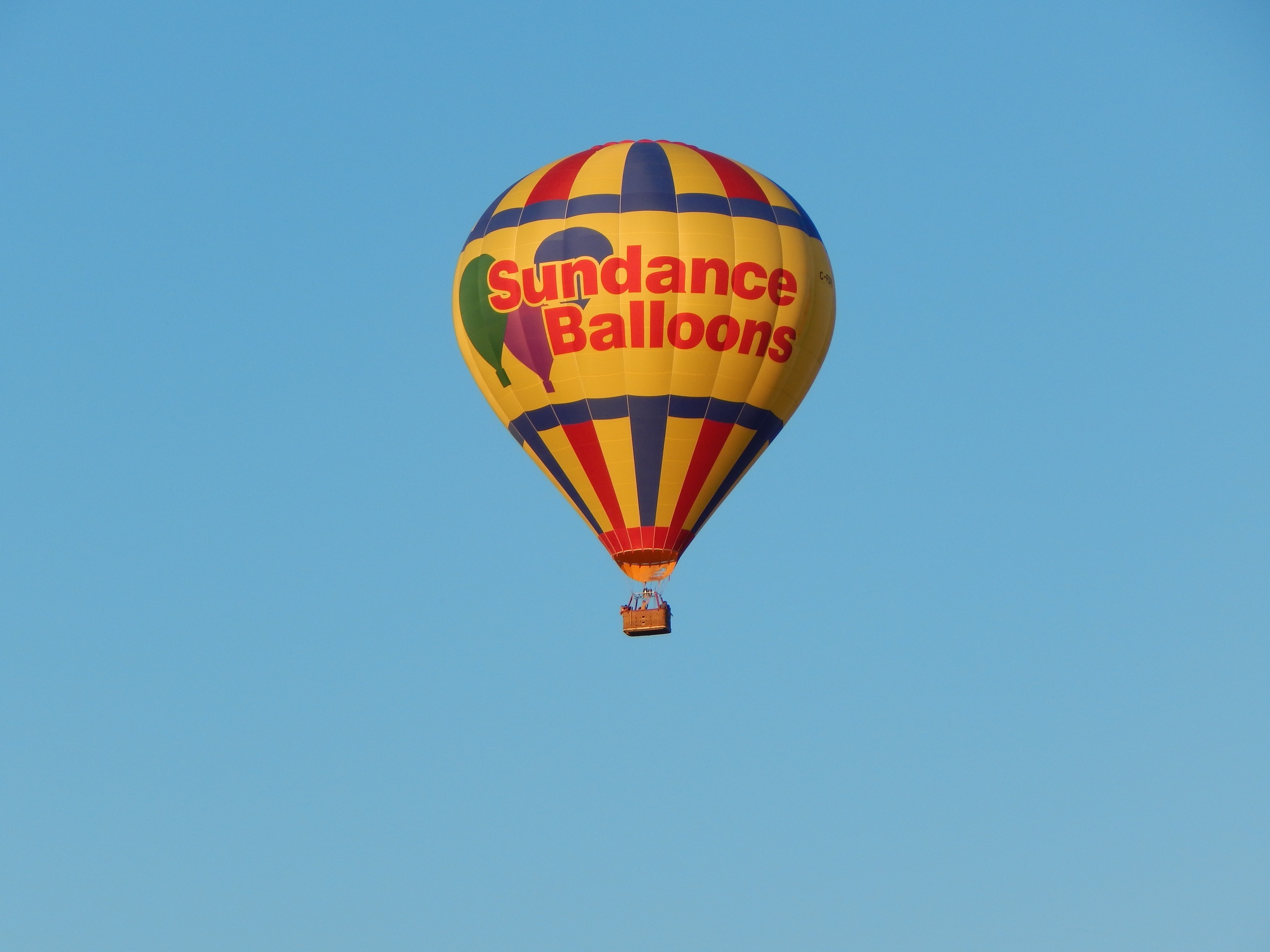 yellow red and blue sundance balloons hot air balloon