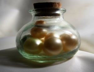 gold pearl in glass bottle thumbnail