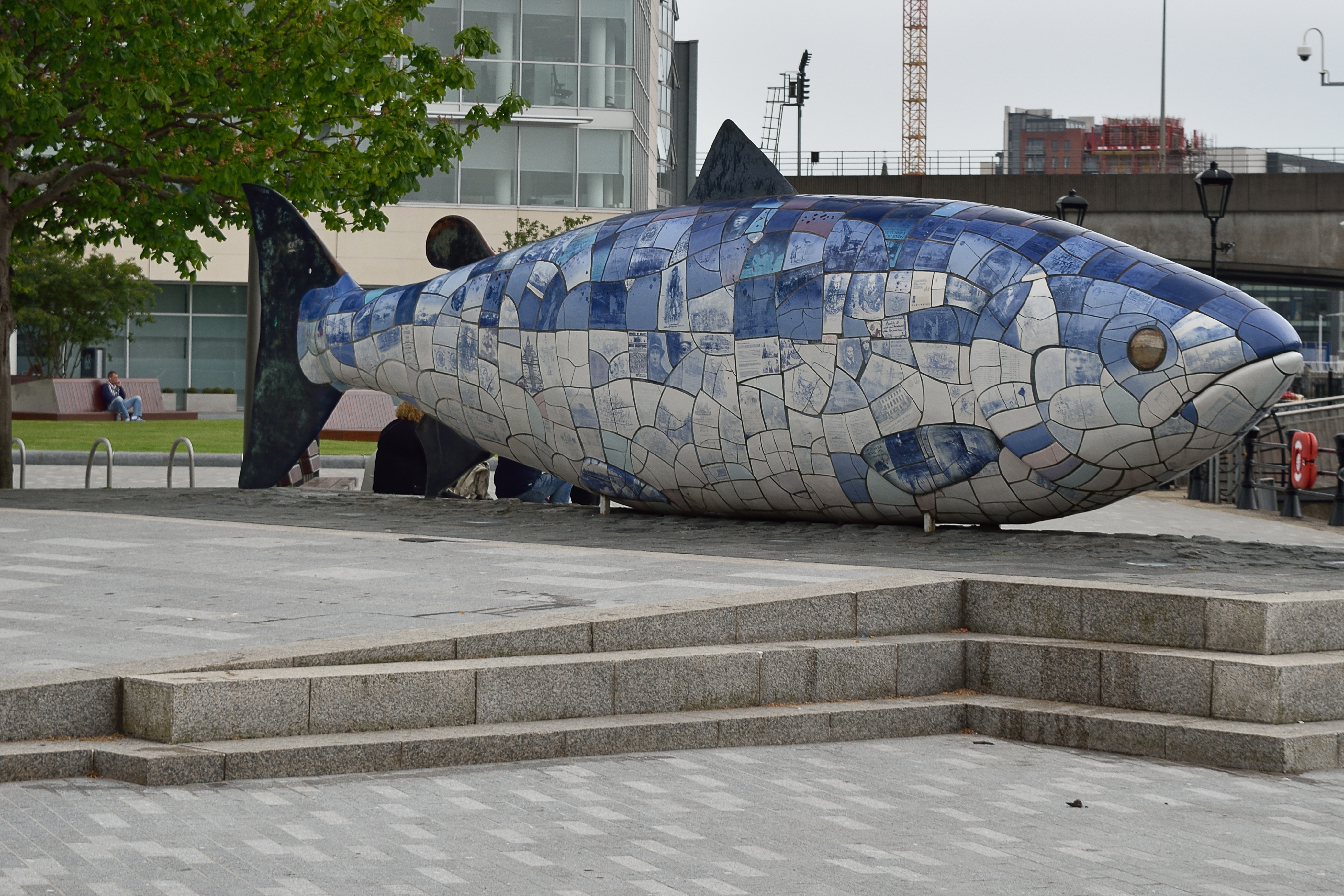 grey and blue fish statue