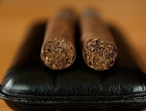 2 cigars and black leather wallet thumbnail