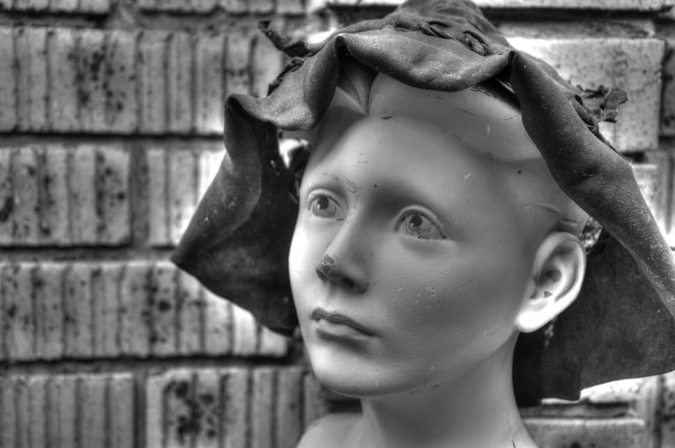 greyscale photo of woman wearing hat statue preview