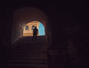 man standing on the middle of the stairs thumbnail