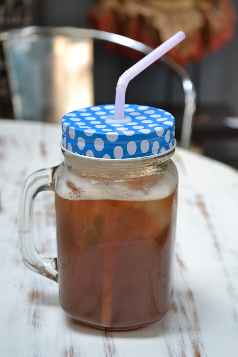 glass mason jar filled with ice tea preview