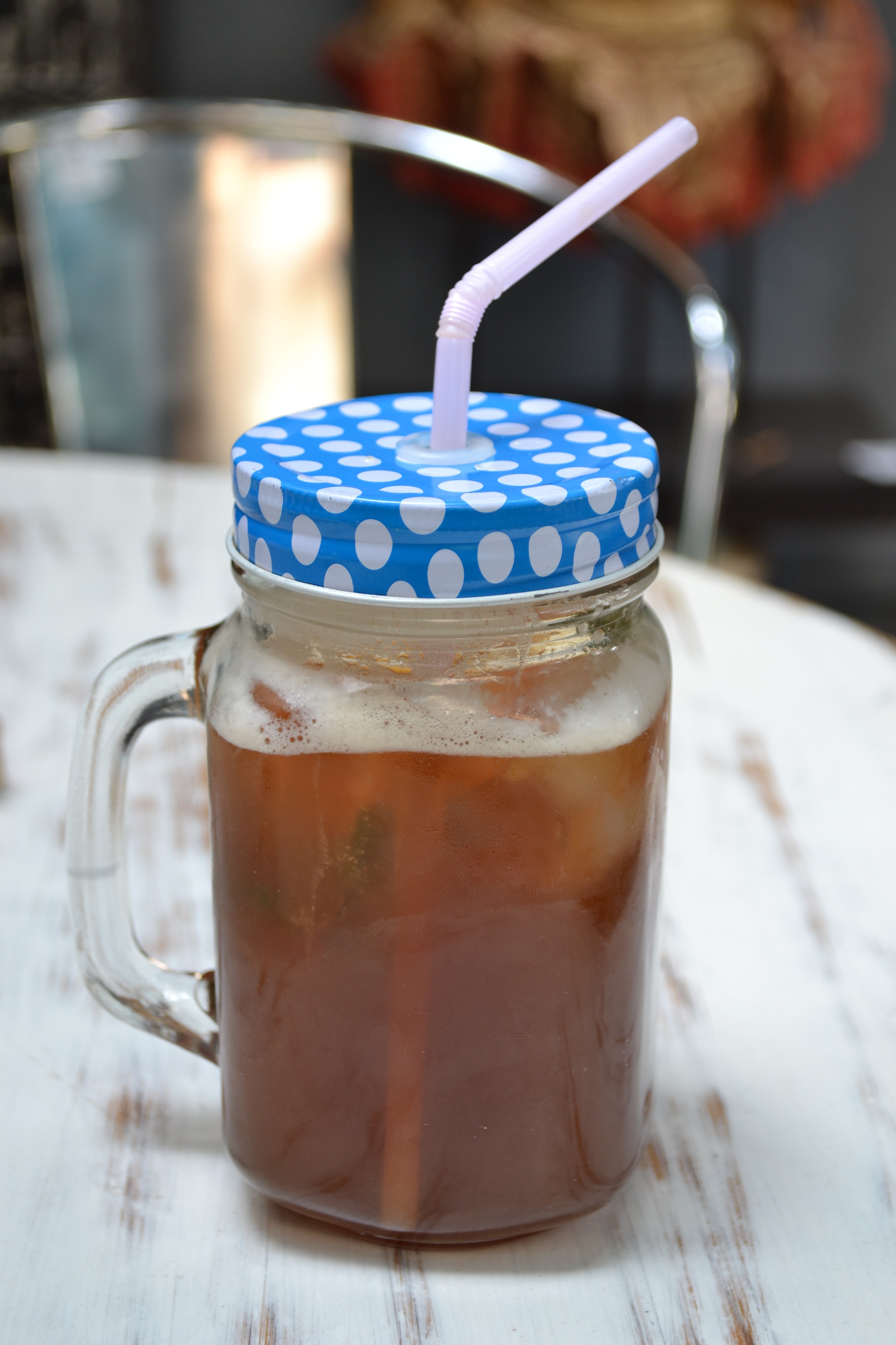 glass mason jar filled with ice tea