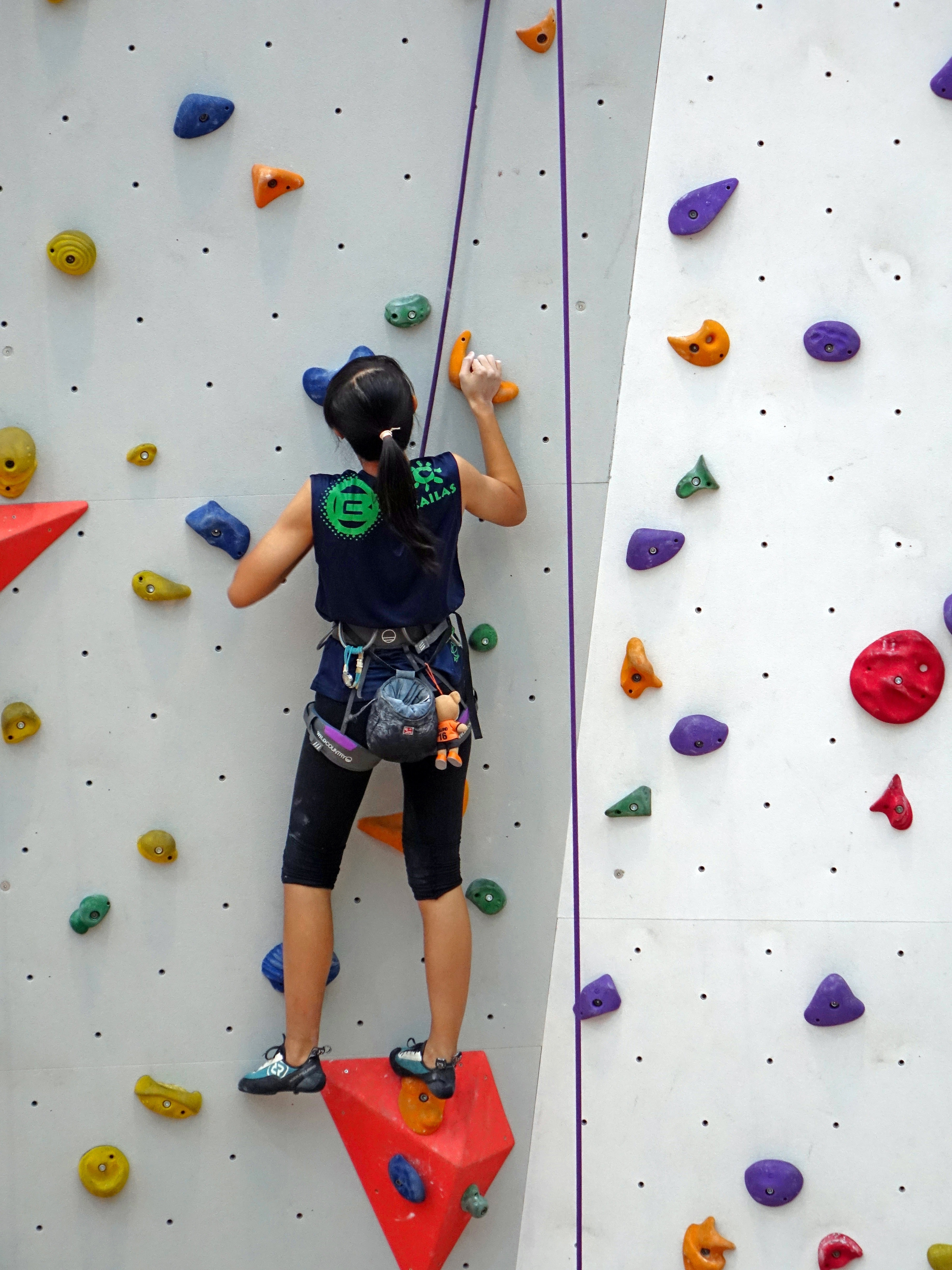 Person taking a wall climbing