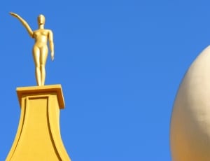 brass human shape statue thumbnail