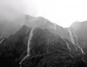 black and white photo of water falls on the mountain thumbnail