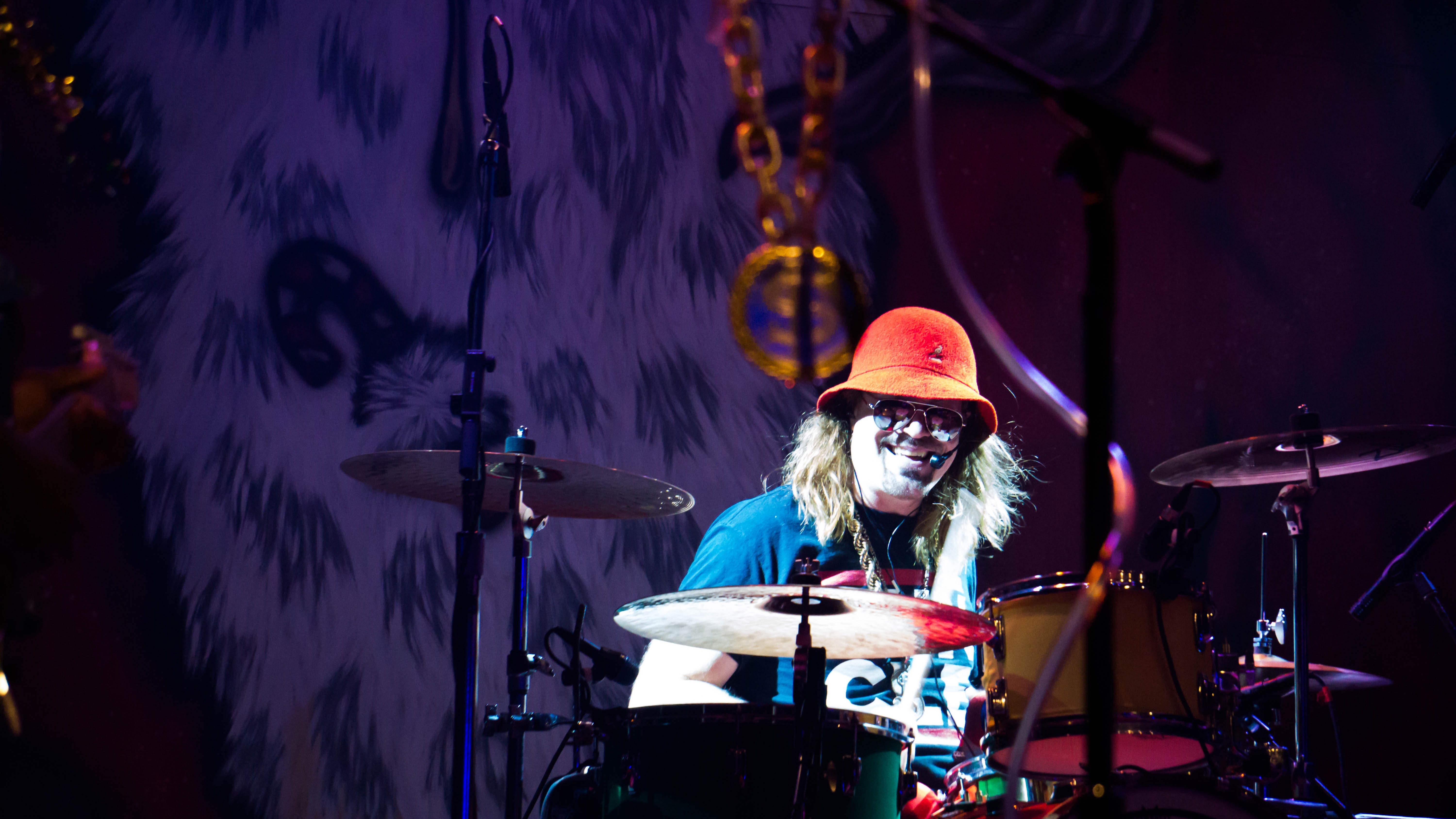 man playing drum on the stage]