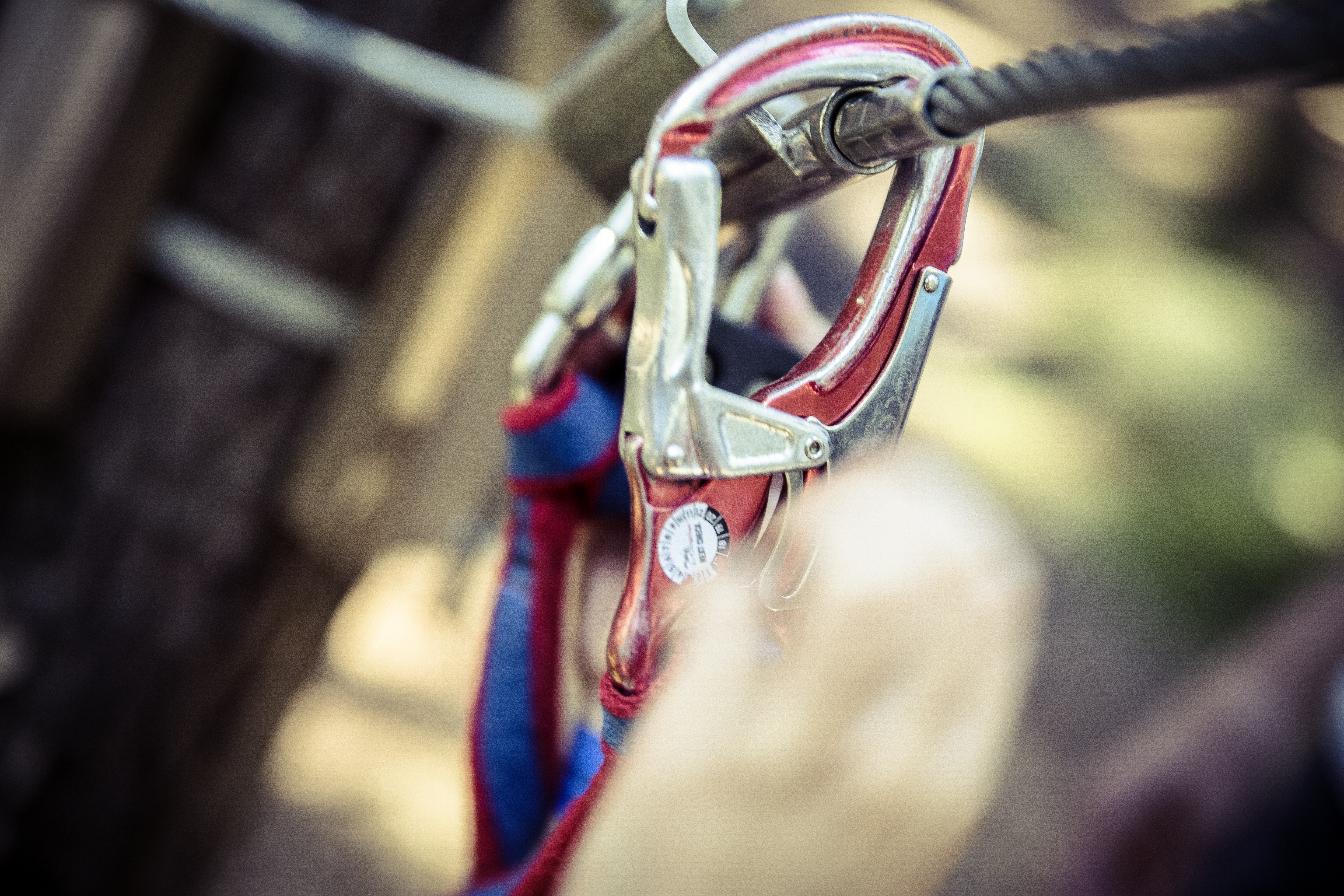 red and gray steel carabiner