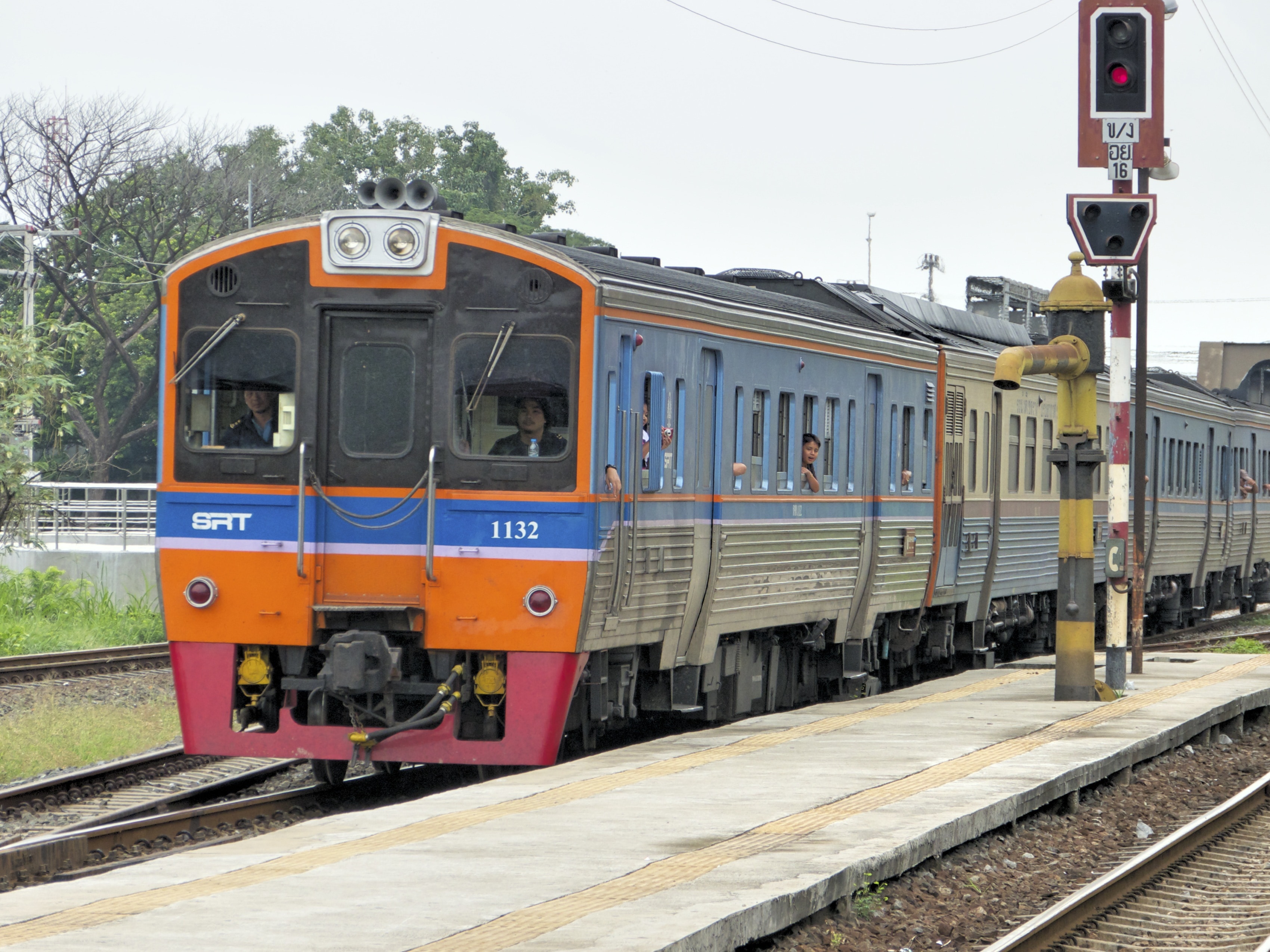 orange and gray train near station