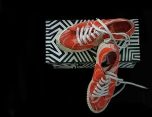 red and white low top sneakers and box thumbnail