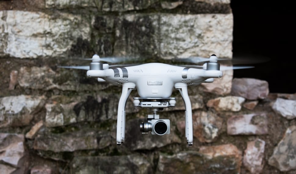 white quadcopter drone preview
