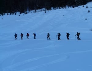 8 person hiking on the snow thumbnail