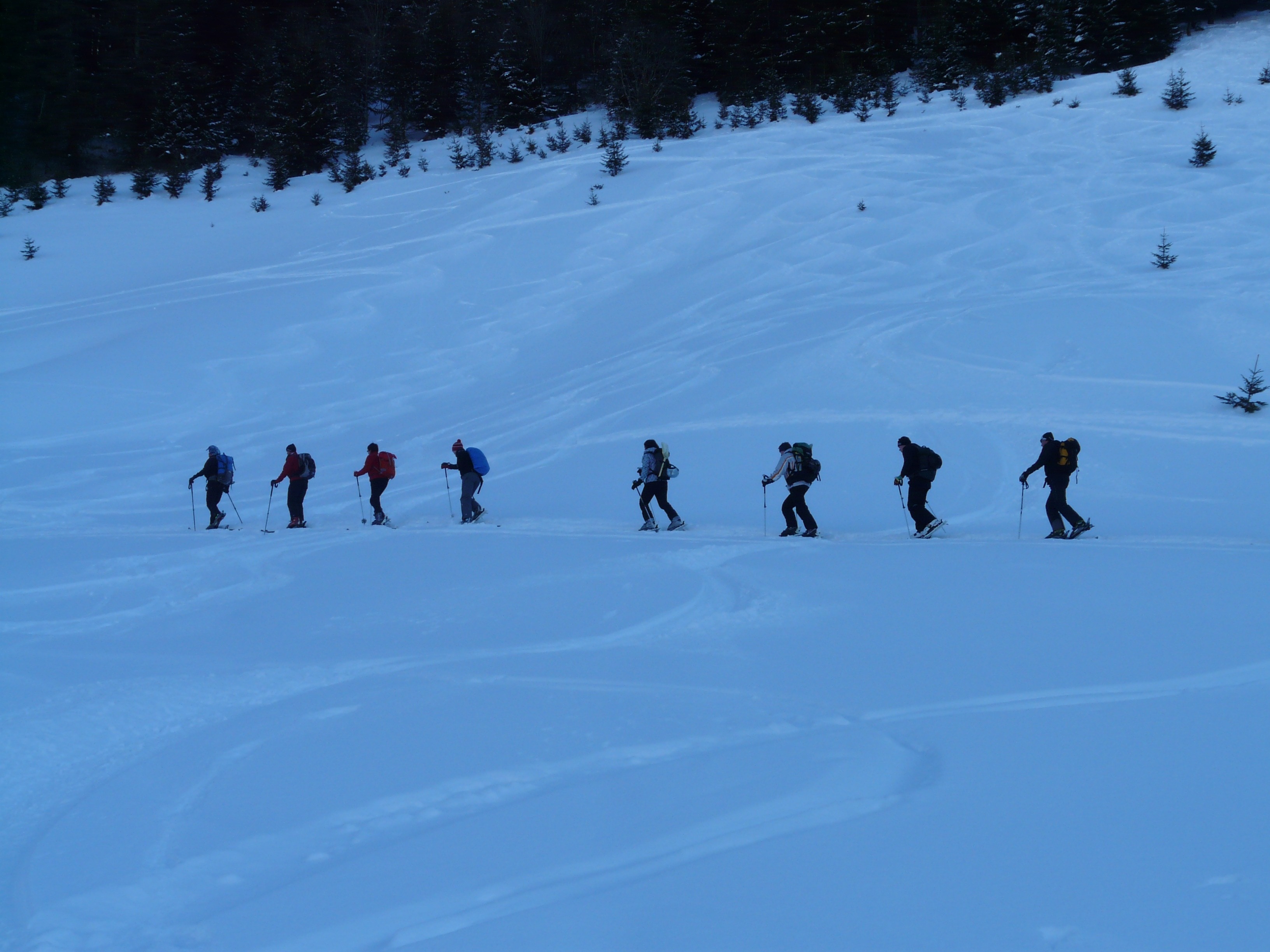 8 person hiking on the snow