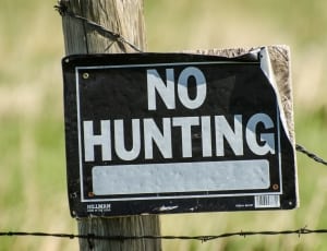 white and black no hunting signage thumbnail