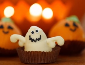 shallow depth of field photo of white ghost cupcake thumbnail