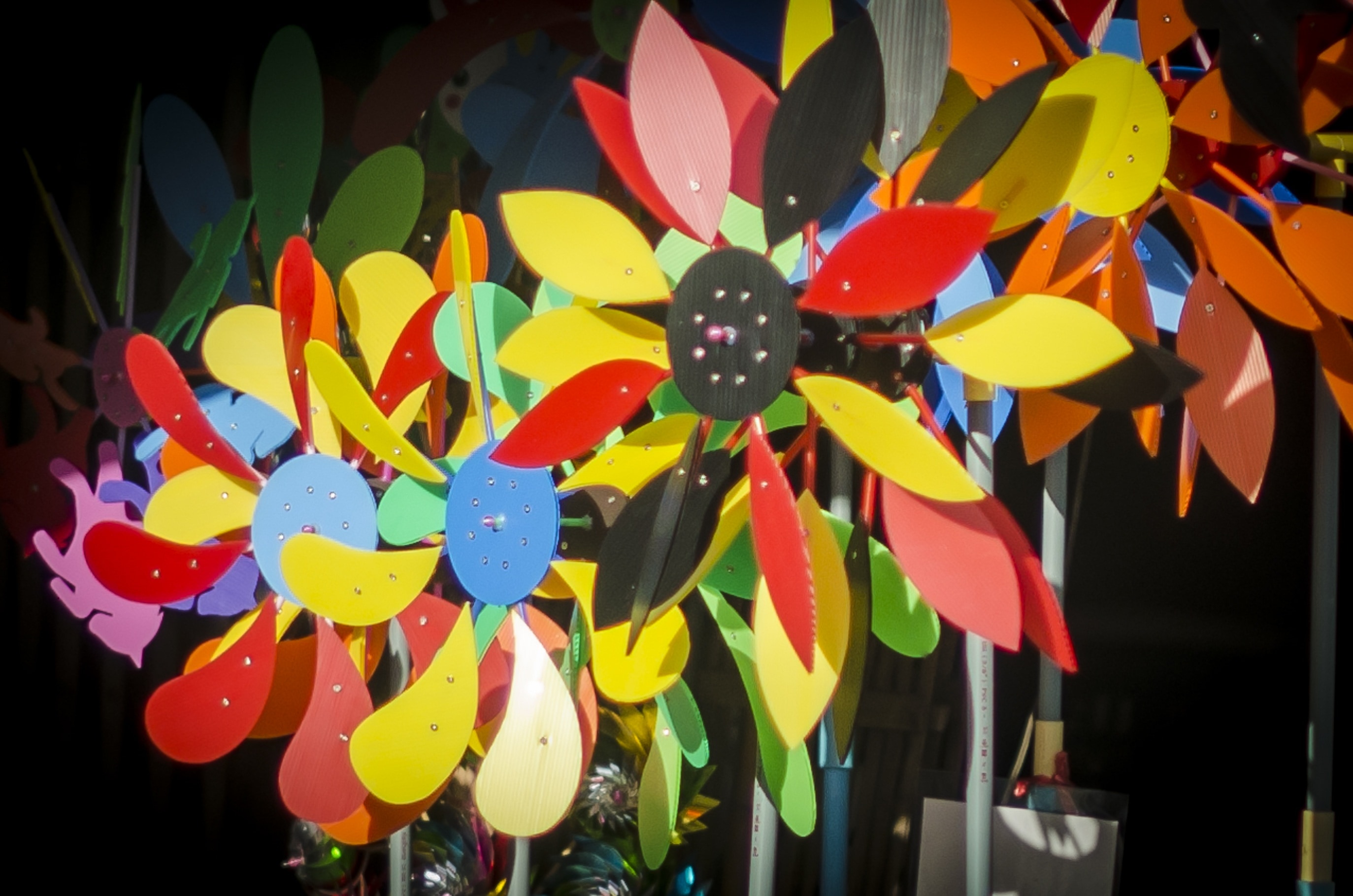 pink red and yellow steel flower fans
