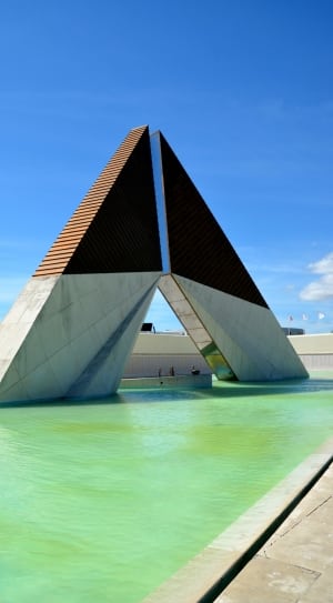 gray and brown concrete triangular shape building thumbnail
