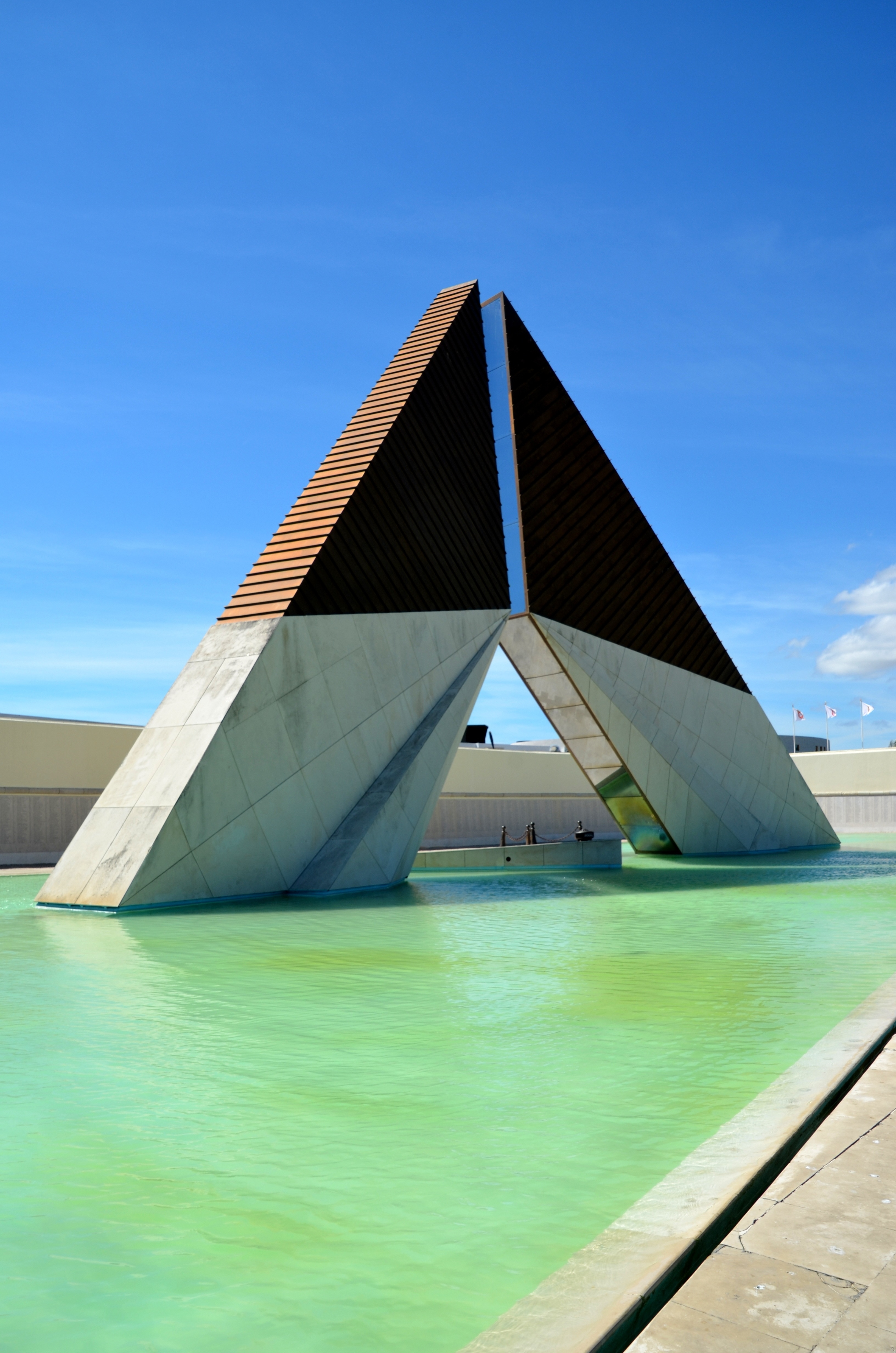 gray and brown concrete triangular shape building