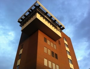 brown and white high rise building thumbnail