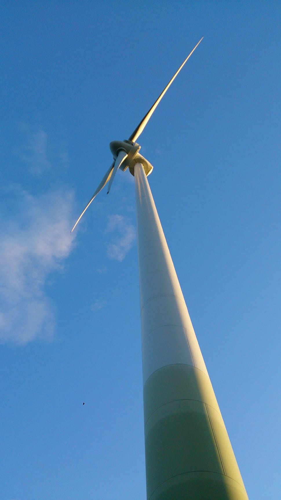 low angle photography of  wind mill under blue sky during daytime preview