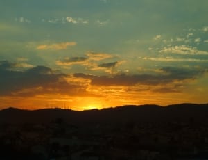silhouette of mountains during sunset thumbnail