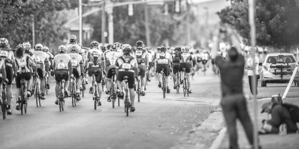 grayscale photo of cyclist parade preview
