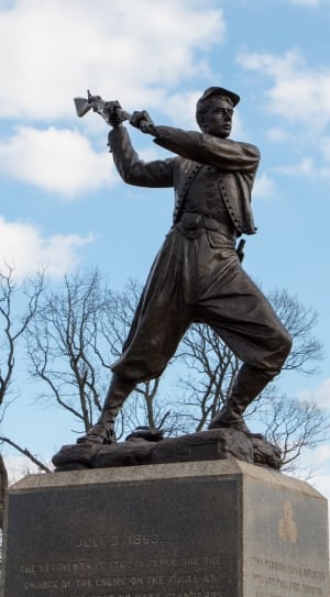 man holding rifle statue thumbnail