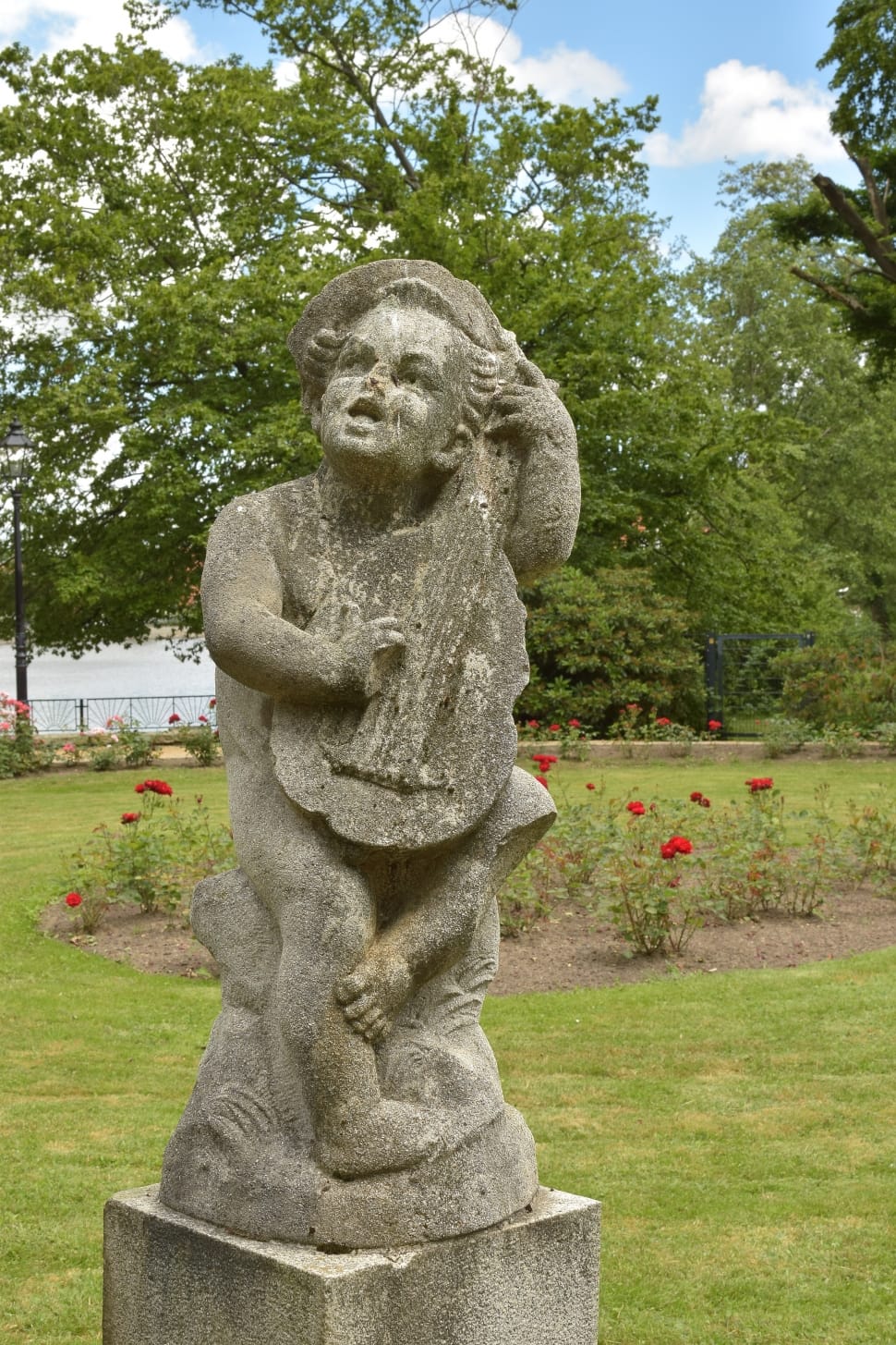 children holding string instrument statue preview