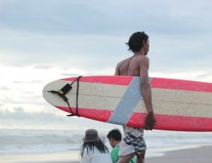 men's red and white surfboard thumbnail
