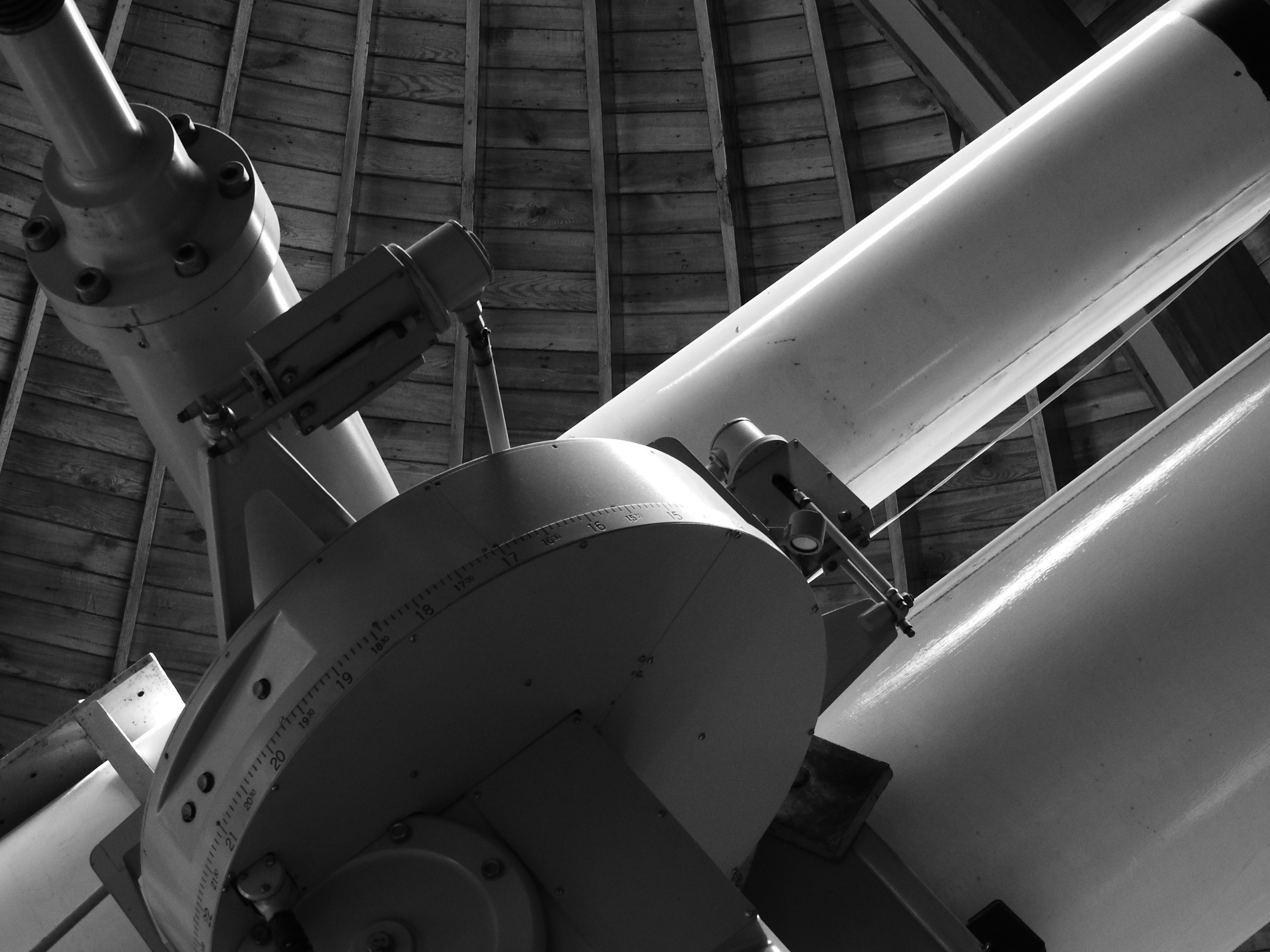 grey scale photo of telescope