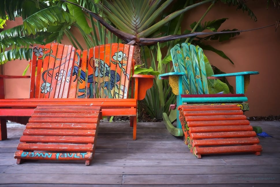 orange wooden lawn bench and teal cyan and green rocking chair preview