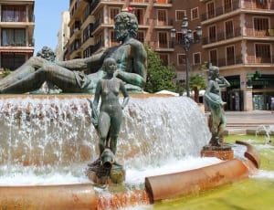 outdoor fountain with human statues thumbnail