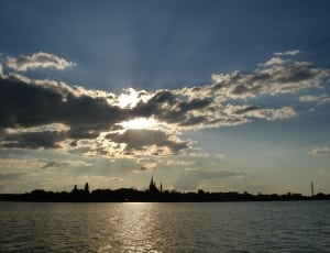 large body of water and sky photo thumbnail
