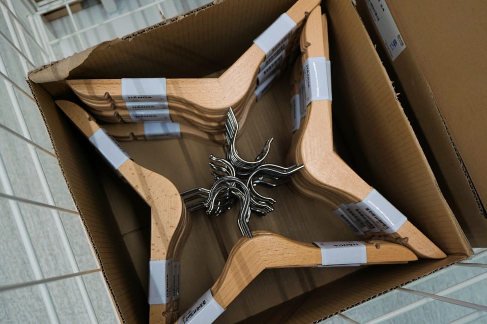 silver and brown wooden clothes hanger in box preview