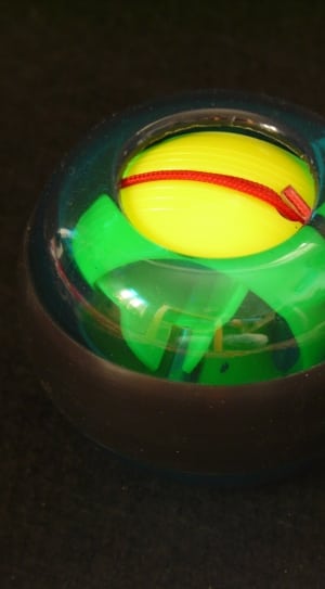 green yellow and plastic round plastic toy thumbnail