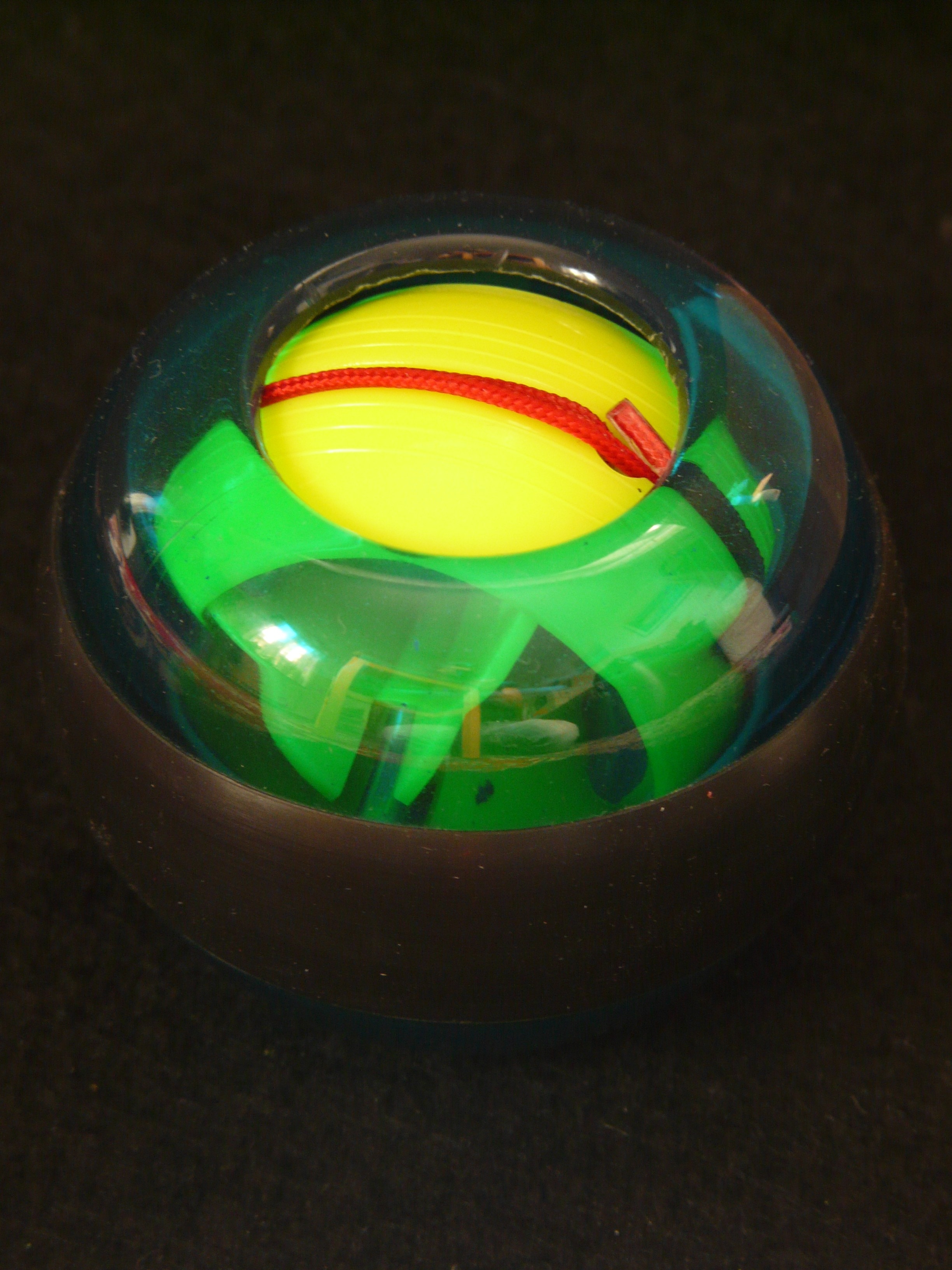 green yellow and plastic round plastic toy